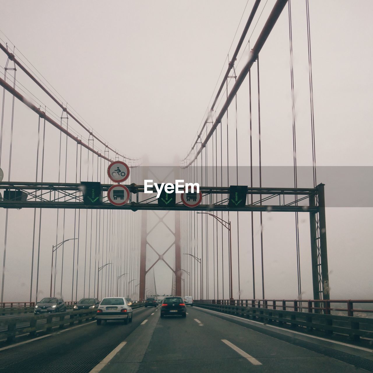 Bridge over highway against sky in city