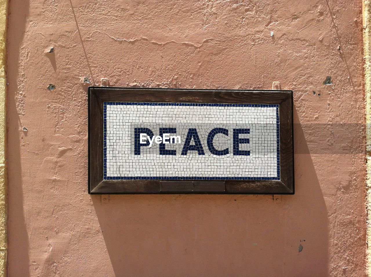 Close-up of peace sign on wall
