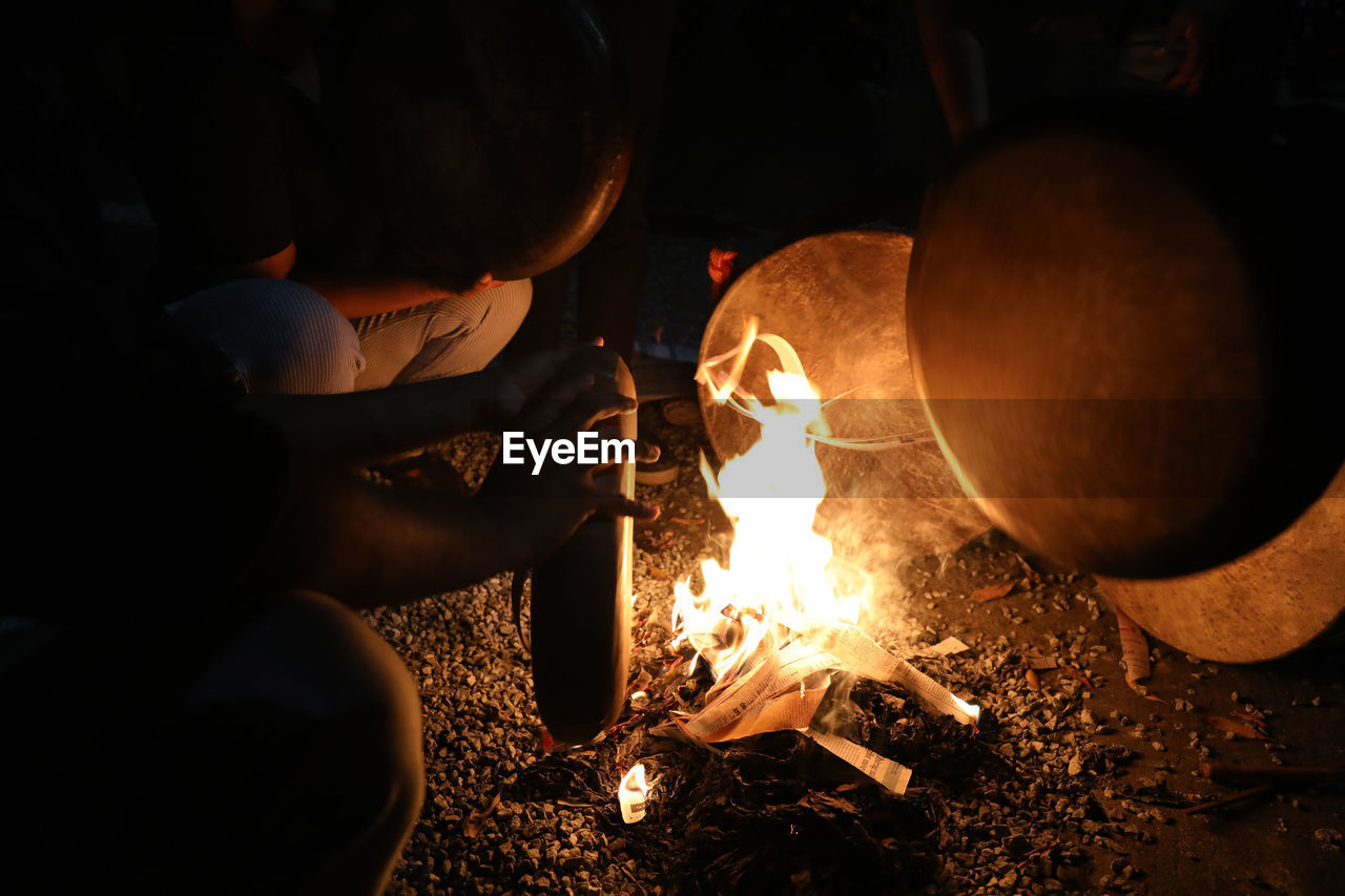 heat, burning, darkness, fire, flame, metal industry, glowing, campfire, men, night, adult, lighting, nature, light, occupation, metal, one person, indoors, motion, holding, working, sparkler, business, skill, industry