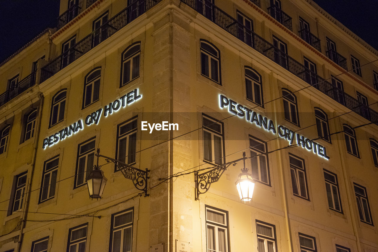 architecture, building exterior, built structure, window, building, city, no people, illuminated, downtown, low angle view, facade, urban area, night, landmark, residential district