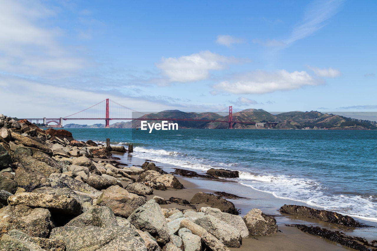 PANORAMIC VIEW OF SEA AND BRIDGE AGAINST SKY