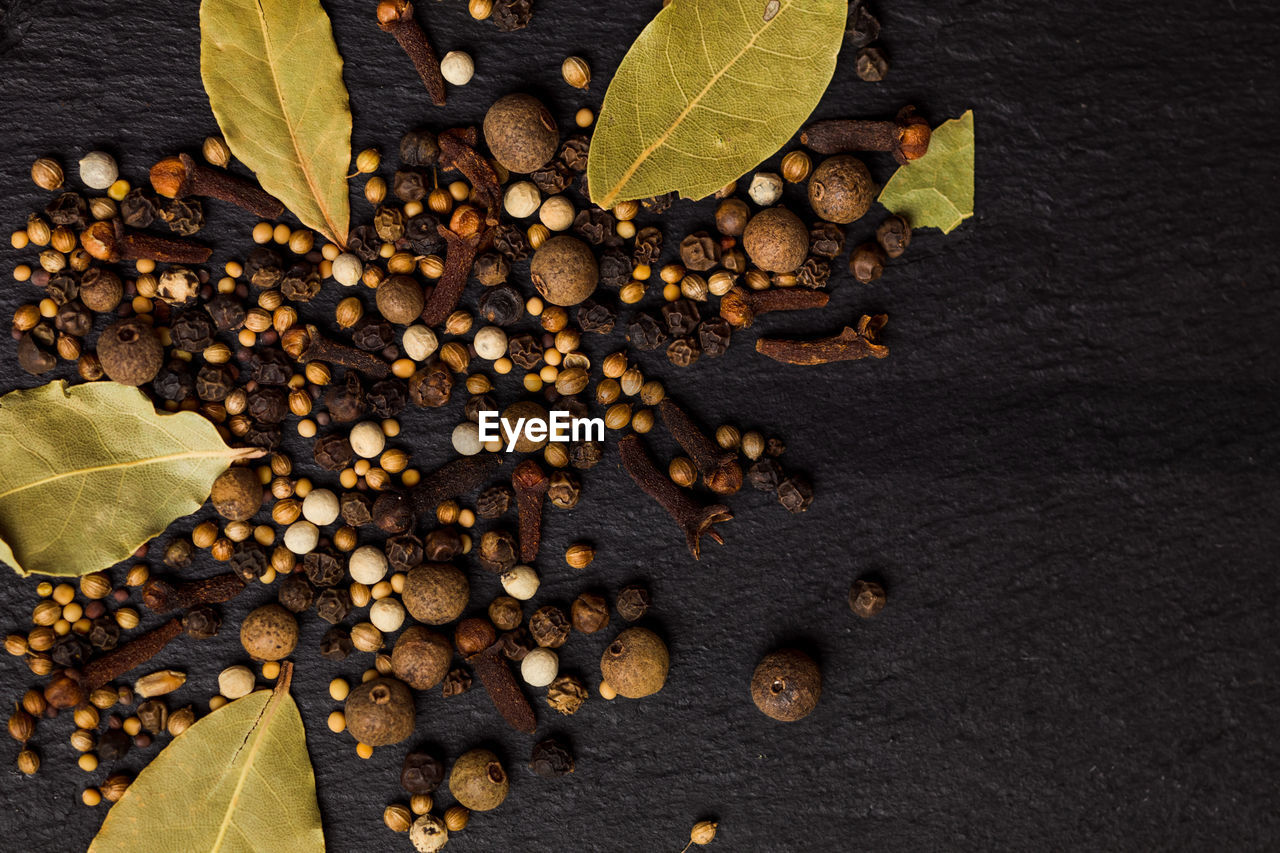 HIGH ANGLE VIEW OF COFFEE BEANS IN FOREGROUND