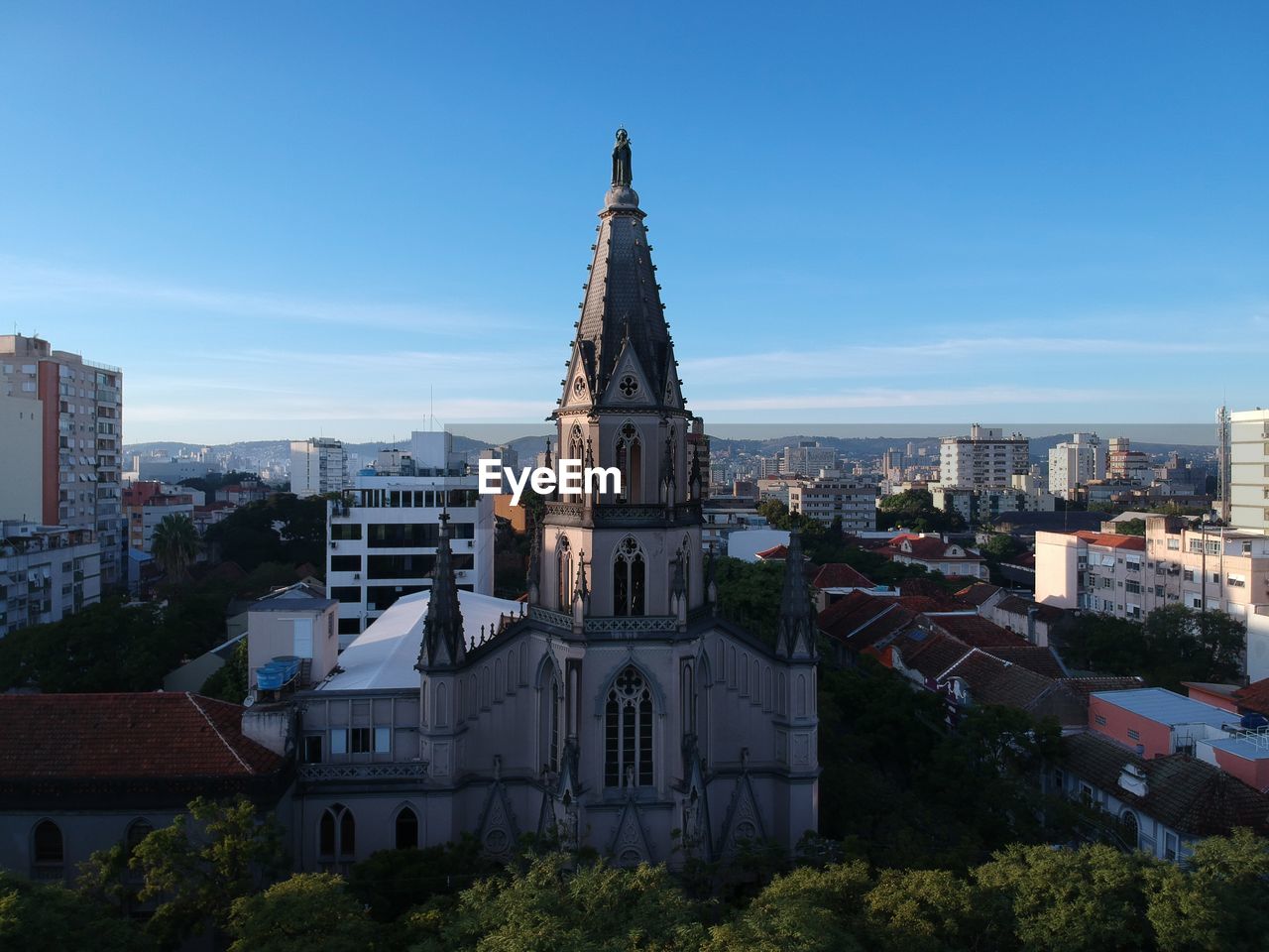 View of buildings against blue sky