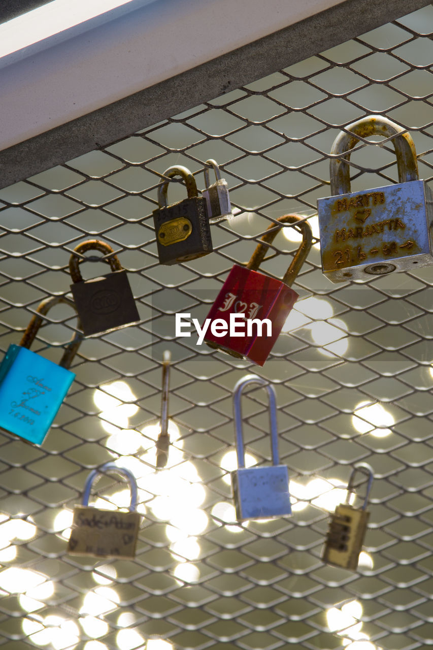 PADLOCKS HANGING ON RAILING