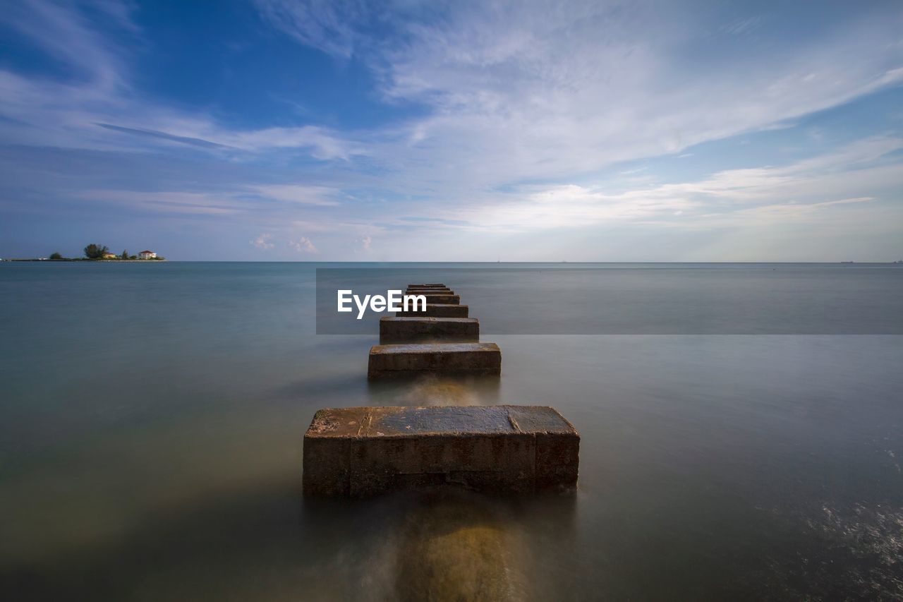 Pier on sea against sky