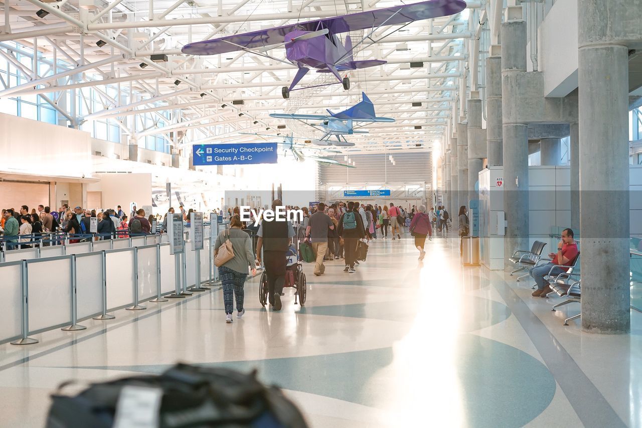 PEOPLE WALKING IN AIRPORT