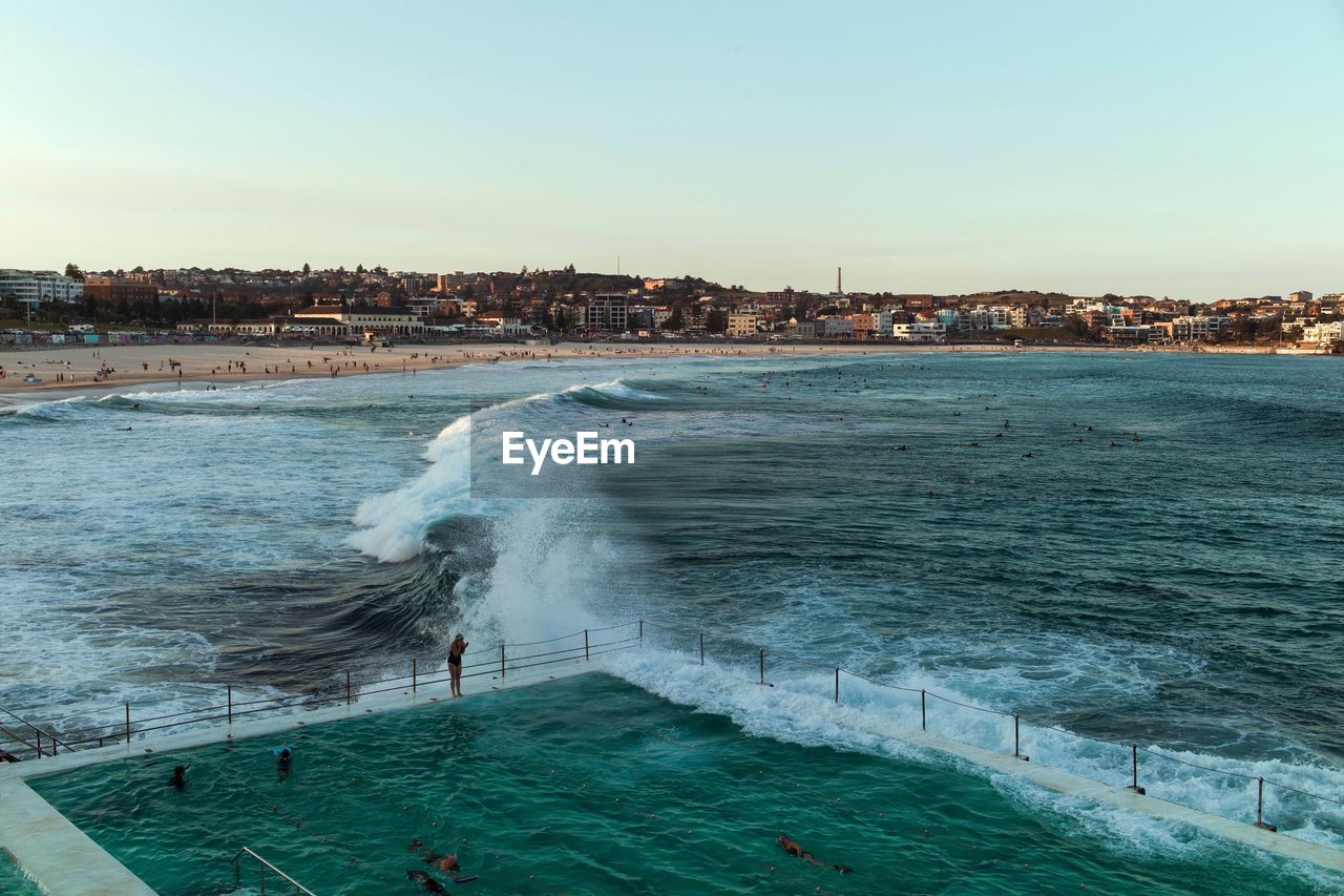 Scenic view of sea against clear sky during sunset