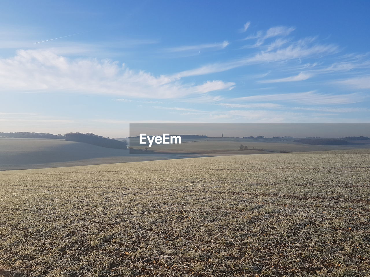 Scenic view of field against sky during sunset