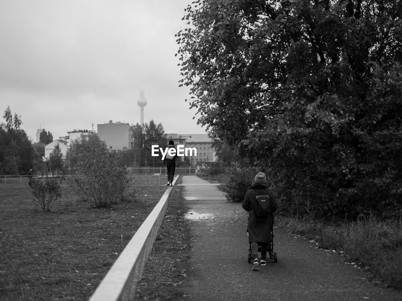 WOMAN WALKING ON ROAD