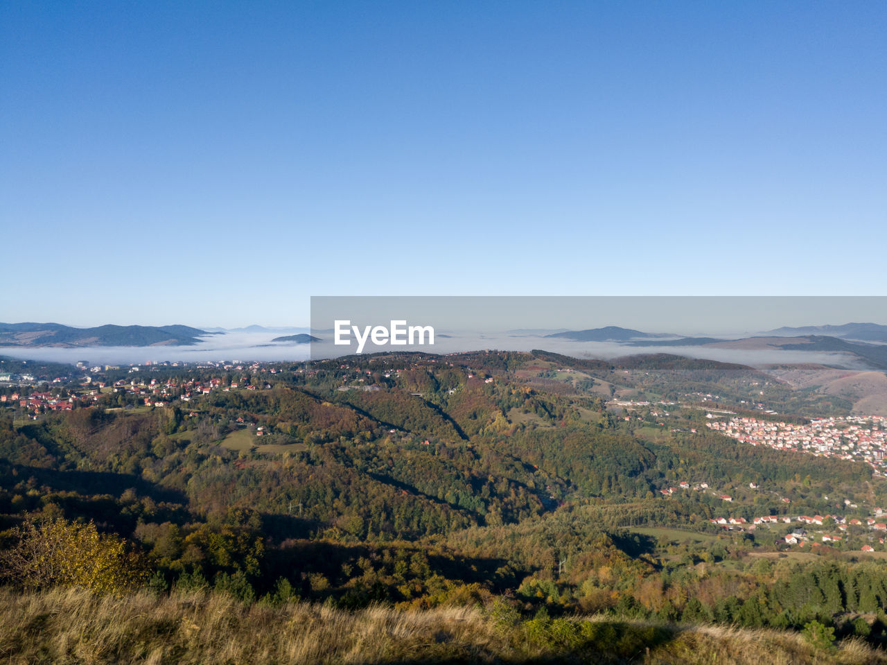 Scenic view of landscape against clear blue sky