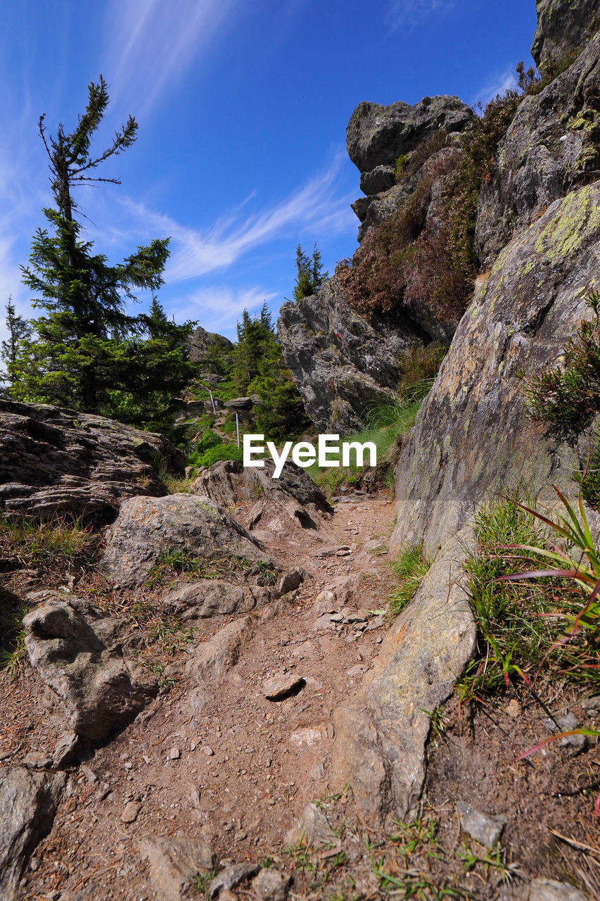 Rock formations on landscape against sky