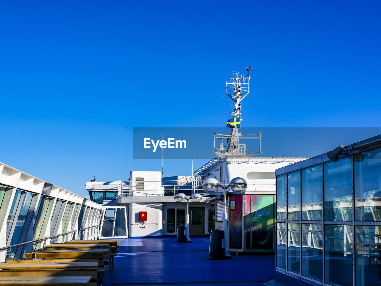 SHIP AT HARBOR AGAINST BLUE SKY