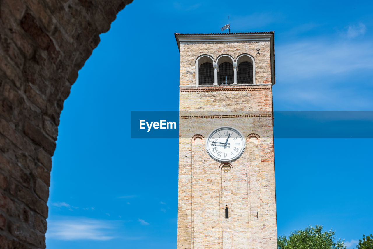 Low angle view of clock tower against sky