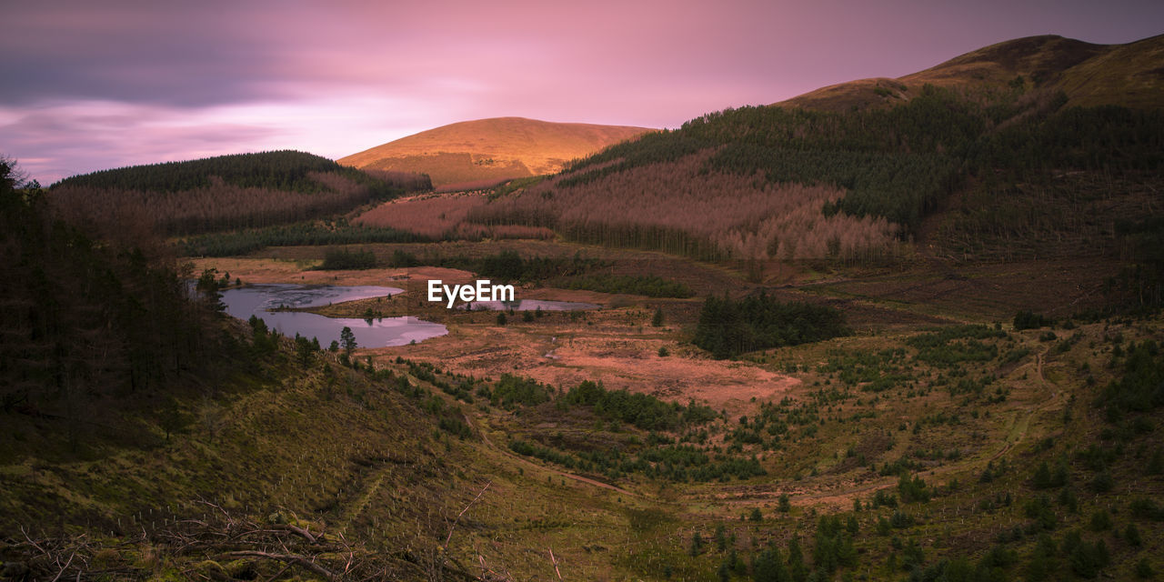 Scenic view of landscape against sky during sunset