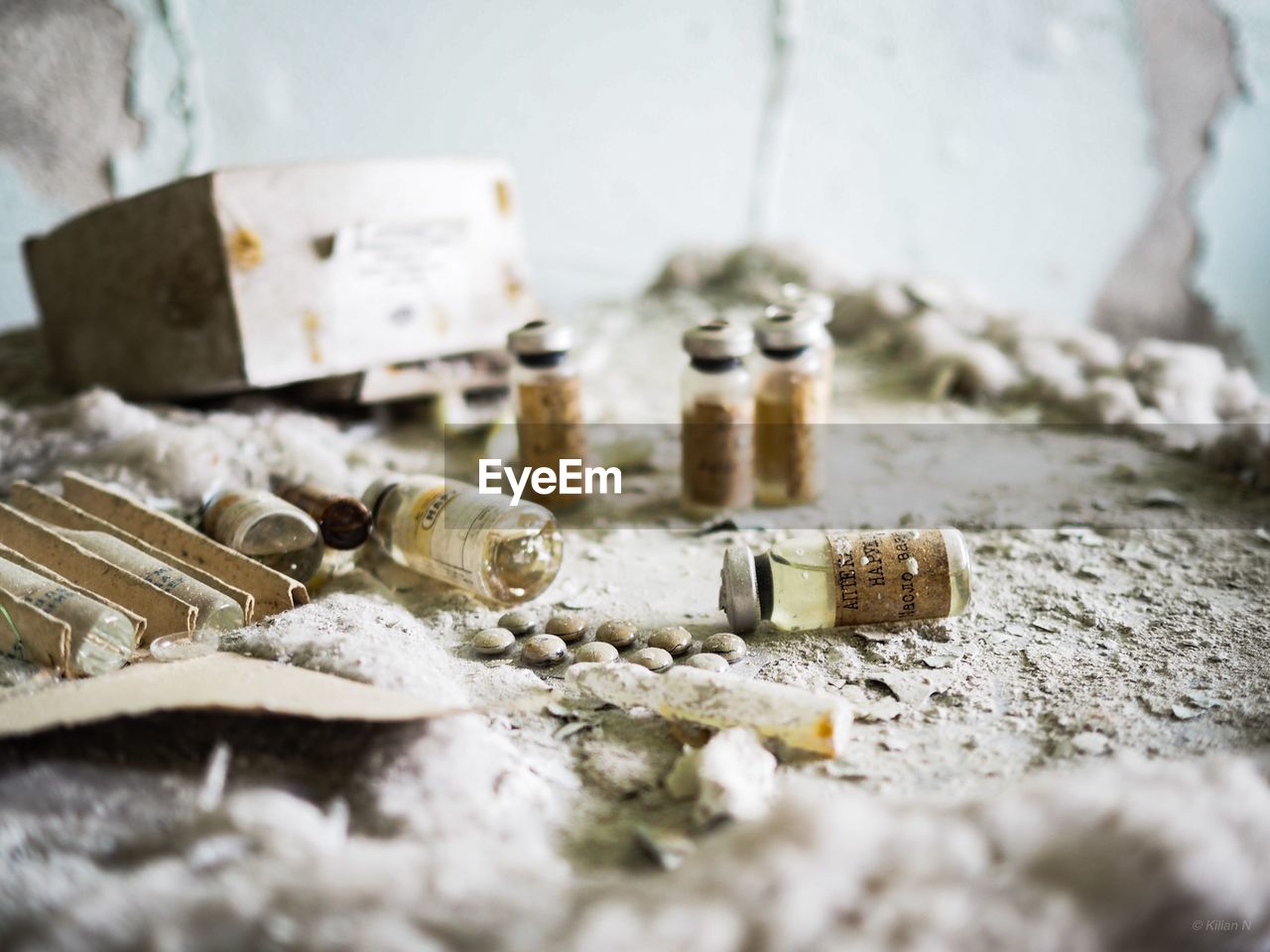 Close-up of abandoned medicines in bottles