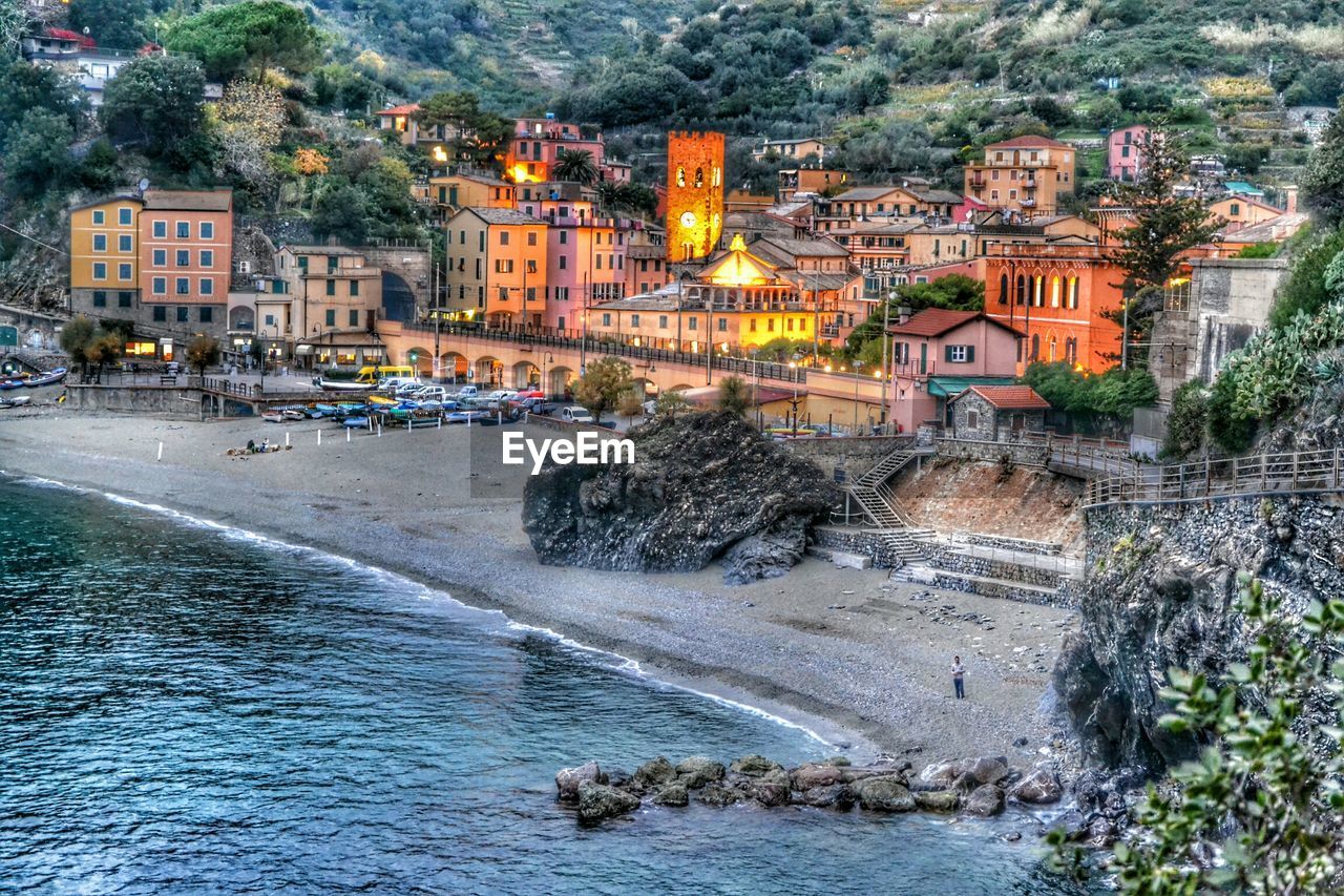 High angle shot of sea with buildings in distance