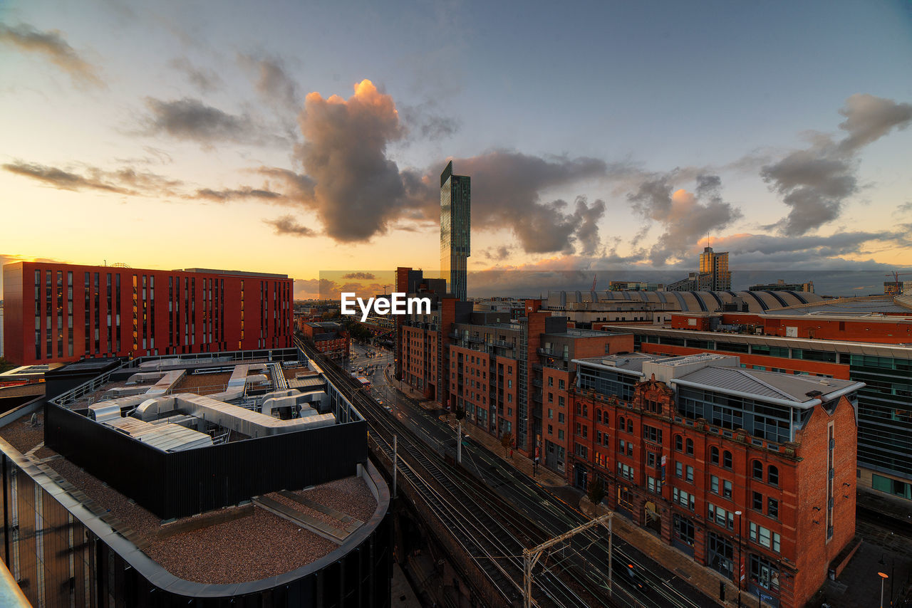 Cityscape against sky during sunset