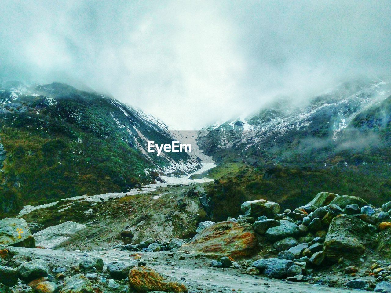 Scenic view of snowcapped mountains against sky