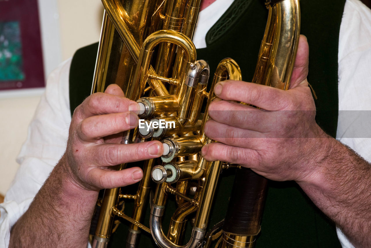 Close-up of man playing musical equipment