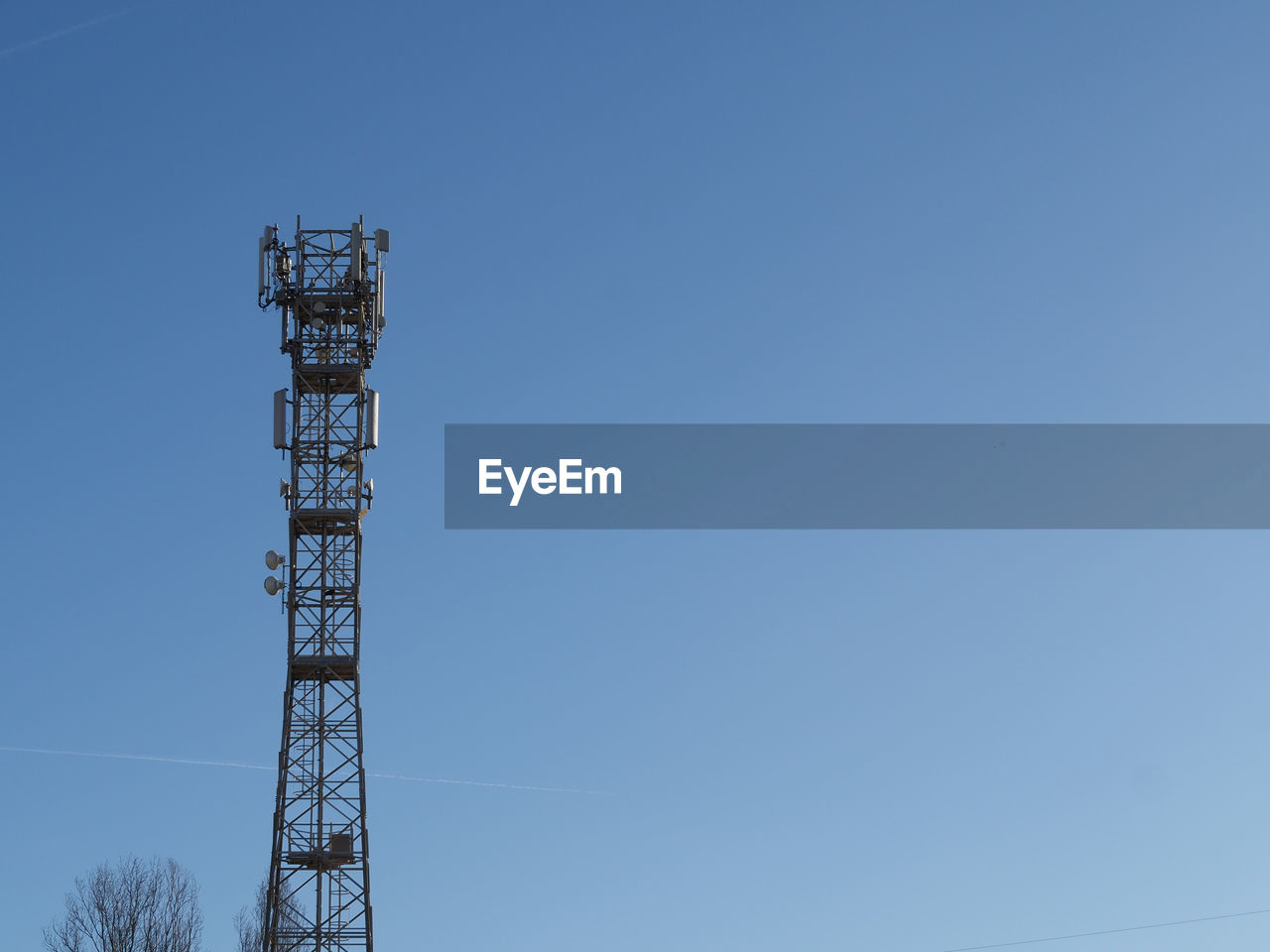 sky, technology, overhead power line, tower, clear sky, blue, built structure, communications tower, architecture, low angle view, transmission tower, broadcasting, electricity, nature, communication, copy space, no people, metal, mast, wireless technology, global communications, day, industry, outdoors, antenna, telecommunications equipment, sunny, outdoor structure, cable, satellite dish, satellite, power generation