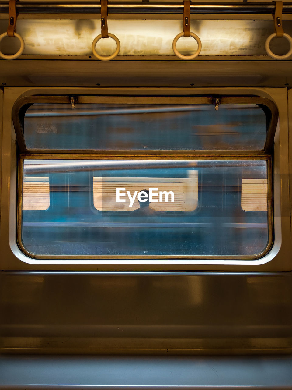 Man seen through train window
