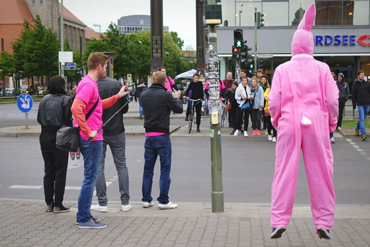 WOMAN STANDING ON CITY STREET