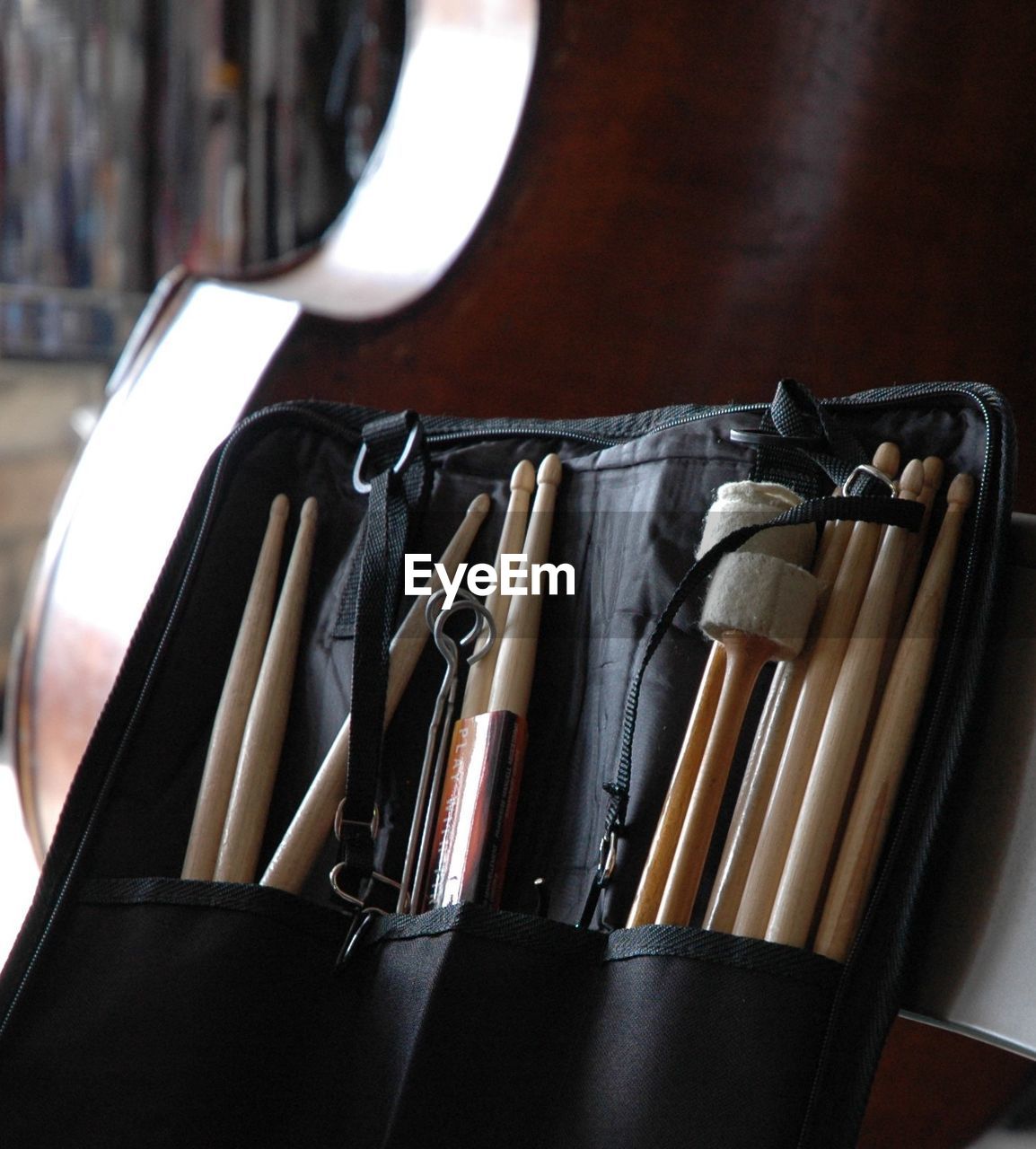 Close-up of drumsticks in bag