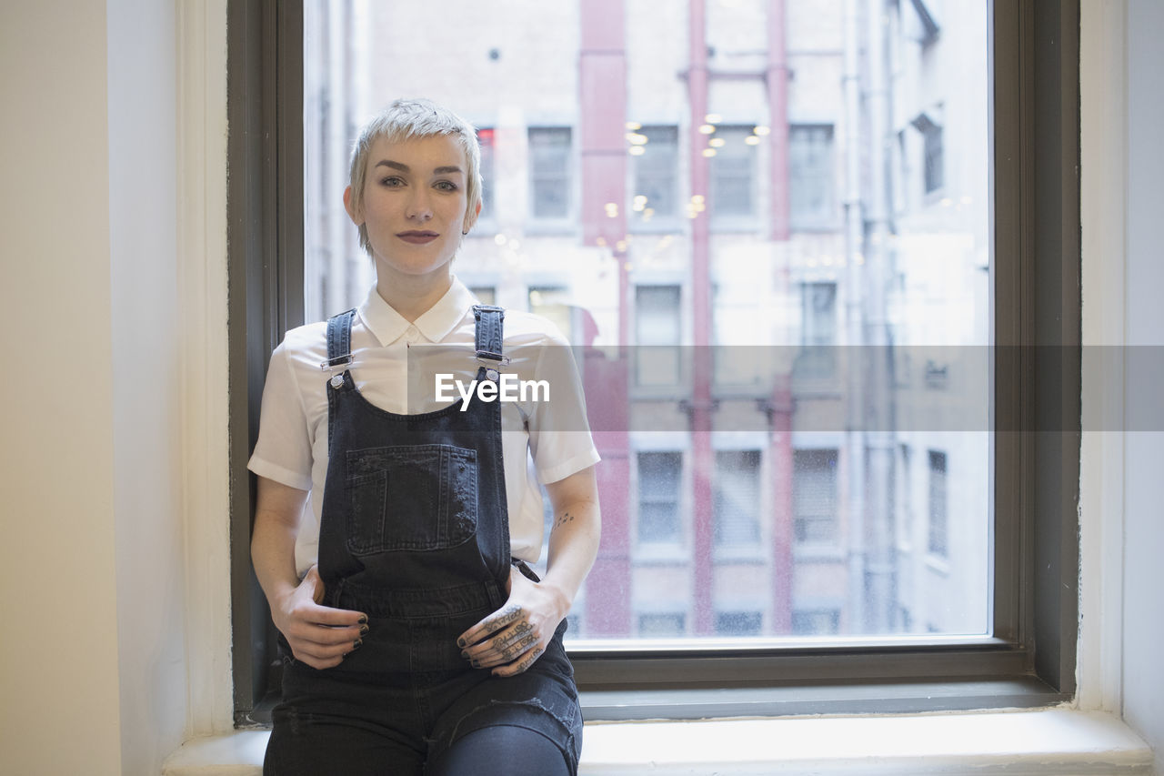 Professional young woman looking at camera.