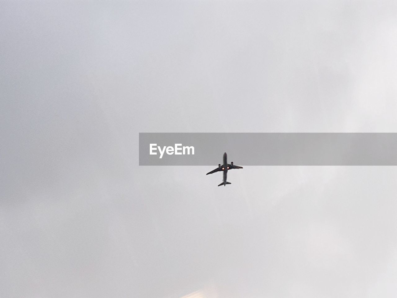 Low angle view of airplane in sky