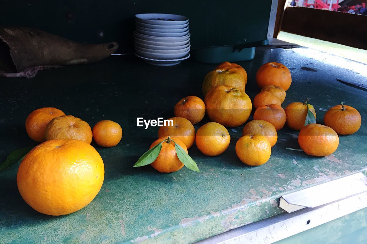 High angle view of tangerines, oranges on table