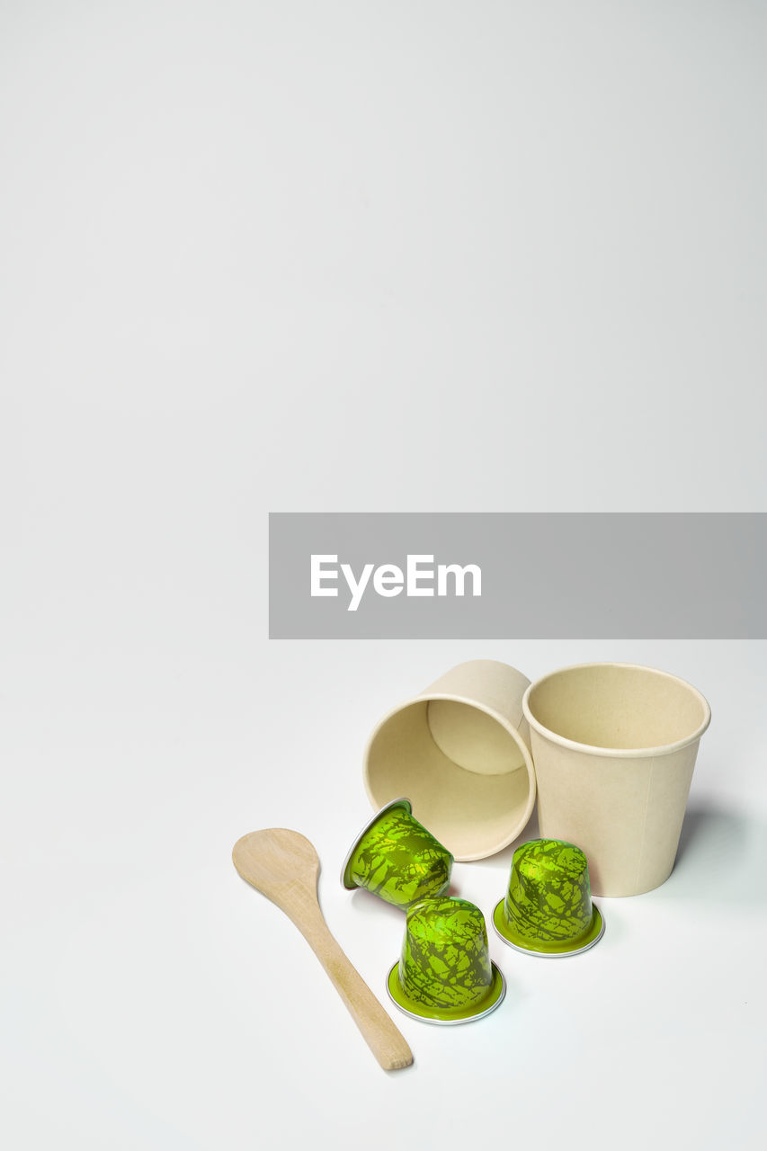 food and drink, studio shot, food, copy space, indoors, wellbeing, healthy eating, tableware, coffee cup, spoon, white background, freshness, vegetable, no people, herb, tea, green, cup, still life, ceramic, organic, kitchen utensil, simplicity, ingredient, group of objects, household equipment, variation, leaf, antioxidant