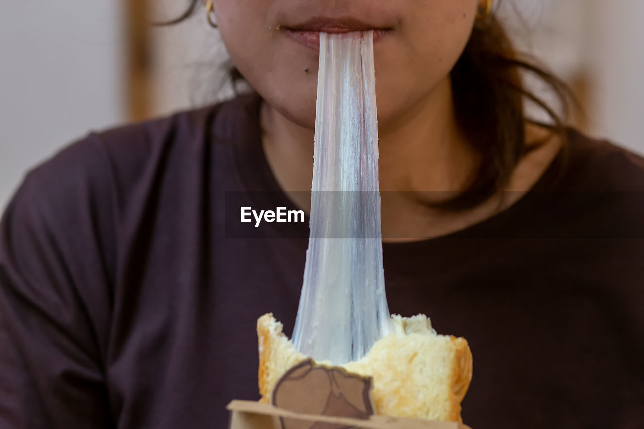 Close-up of woman eating food