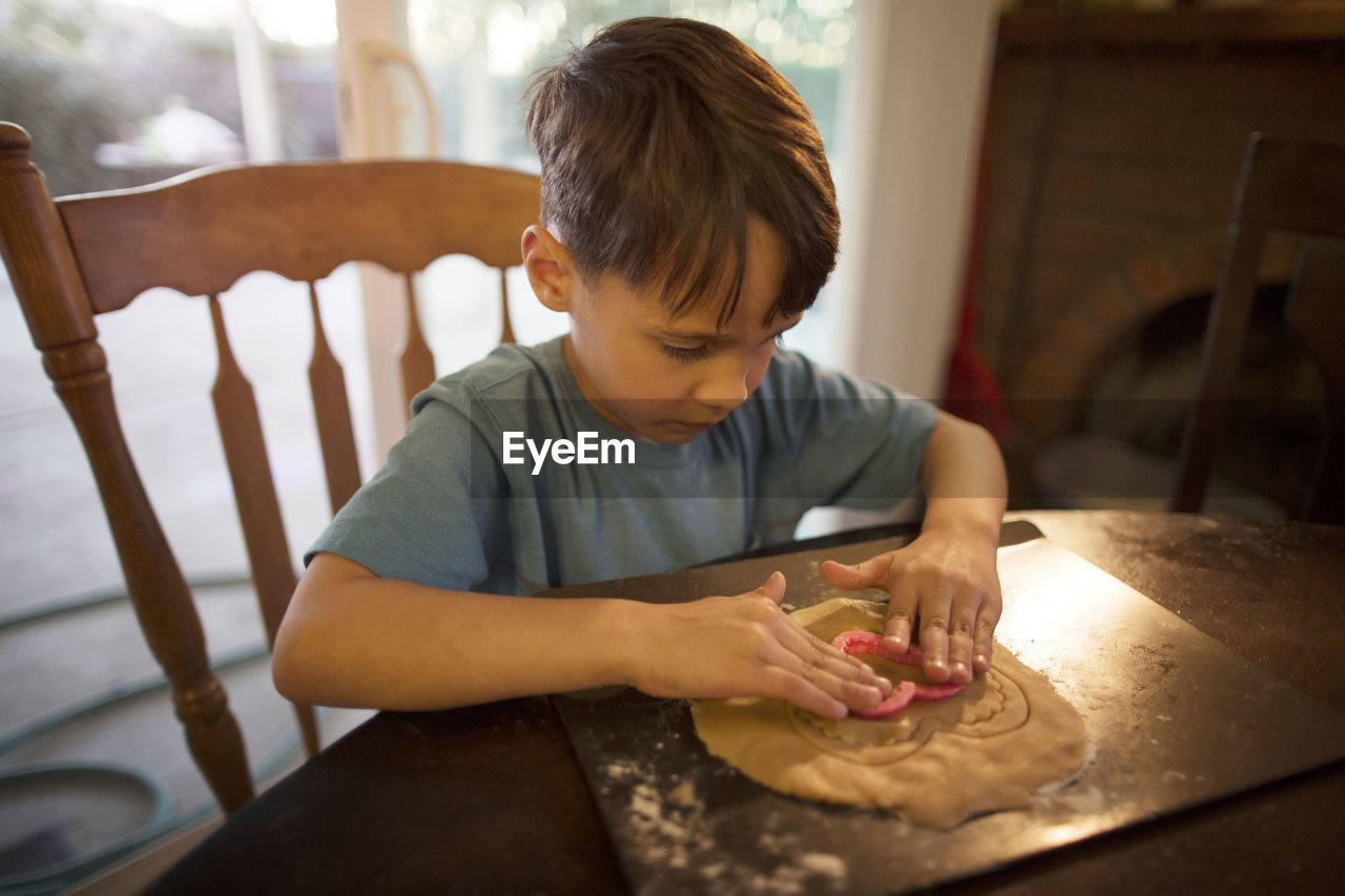 Boy preparing cookies at home