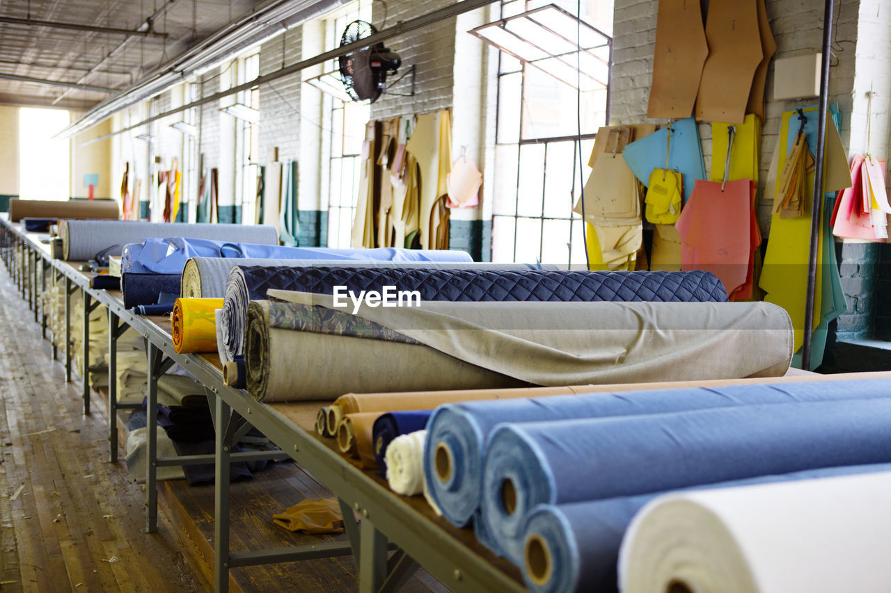 Fabric rolls on table in factory