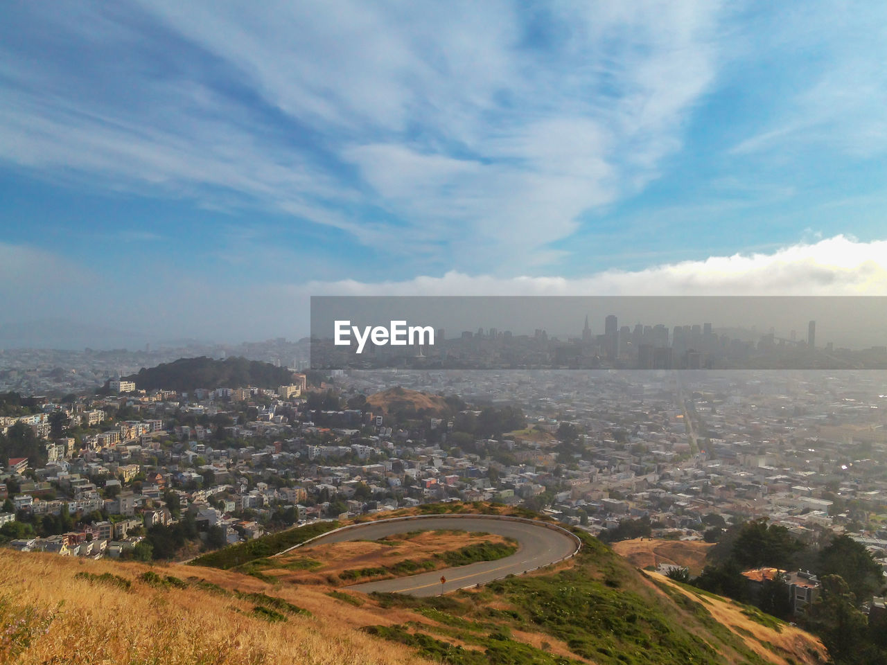 High angle view of city against cloudy sky