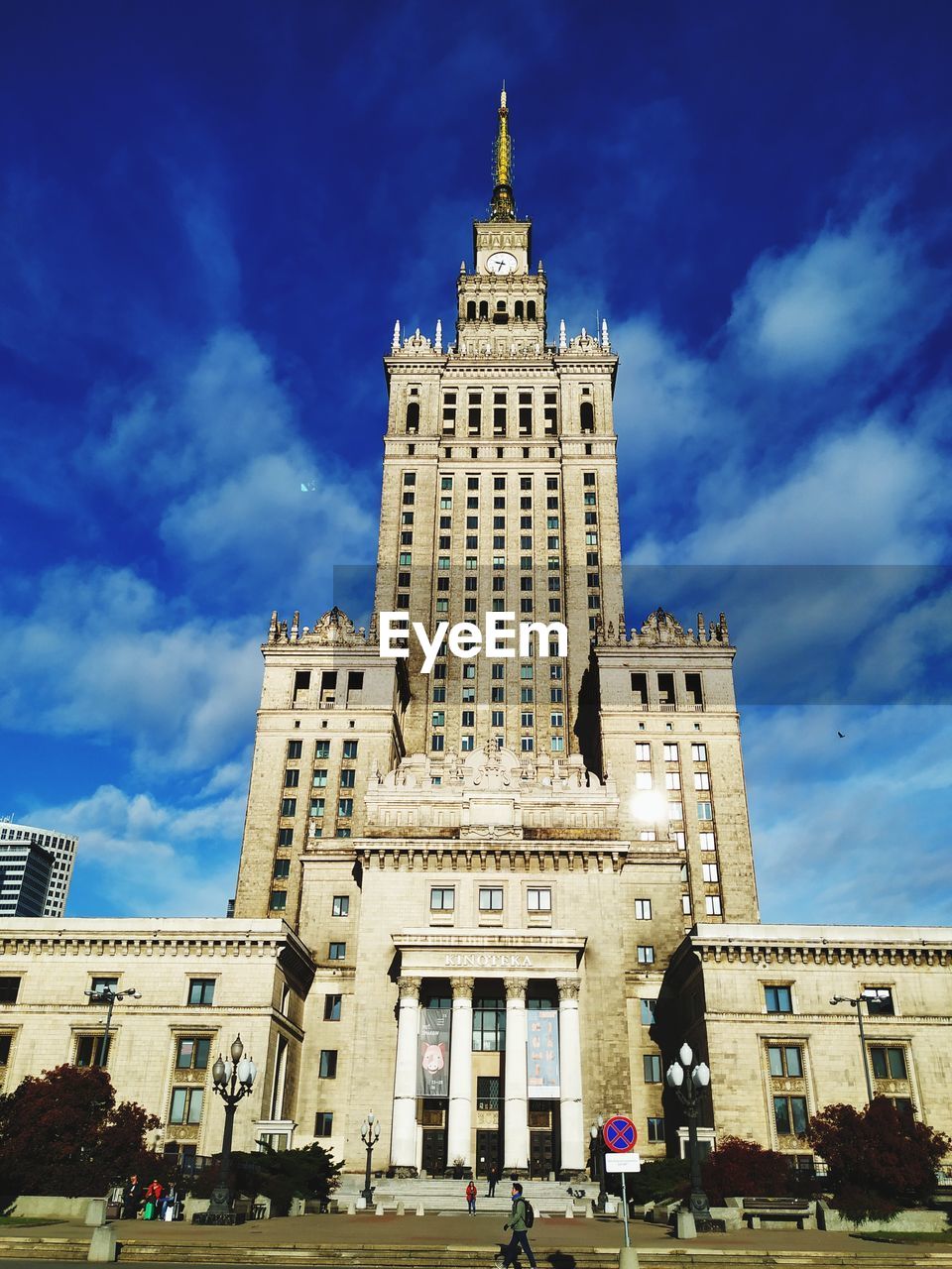 Low angle view of buildings against cloudy sky