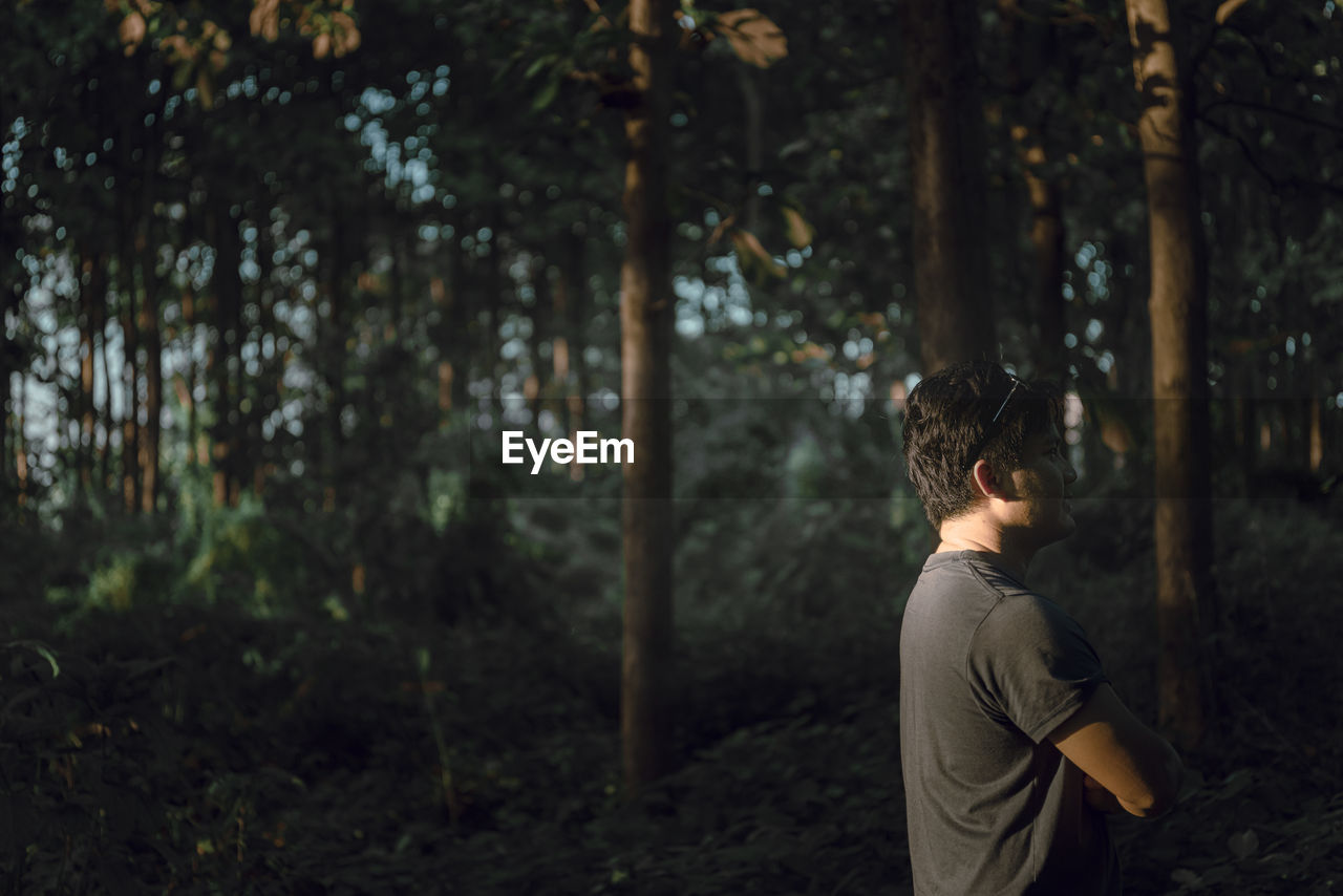 Man standing in forest