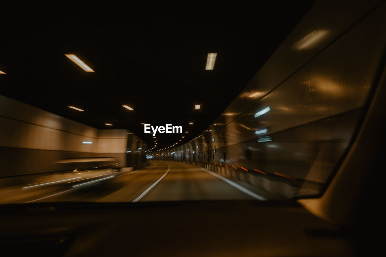 Close-up of car on road at night