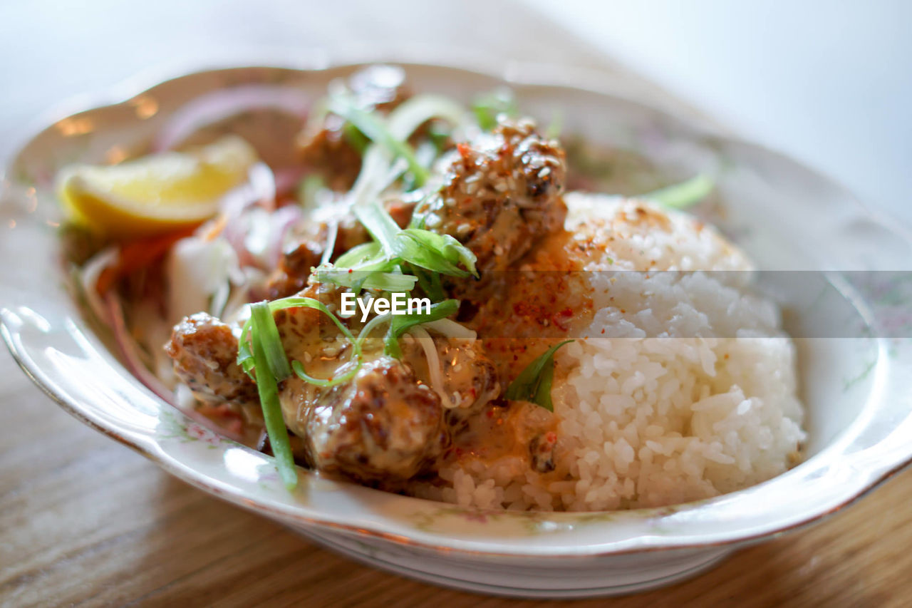 Close-up of karaage don served with rice on table