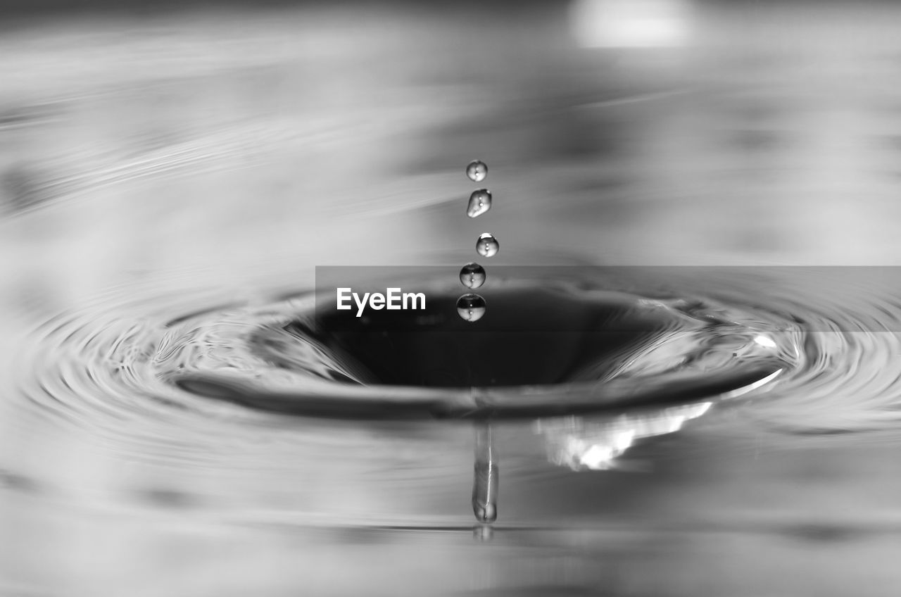 Close-up of water drops falling in sink