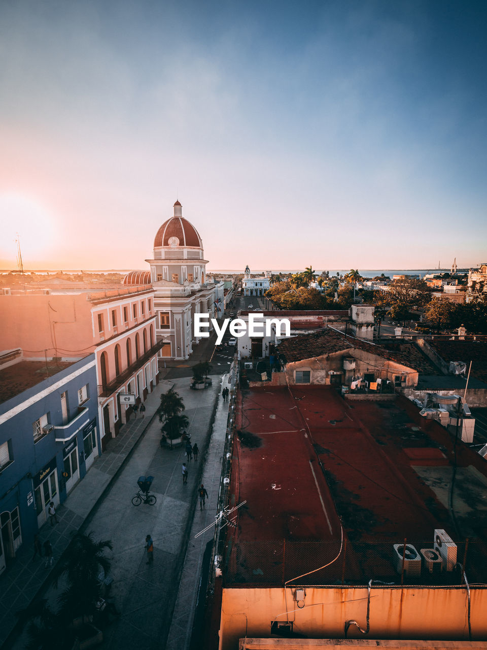 High angle view of city street against sky during sunset