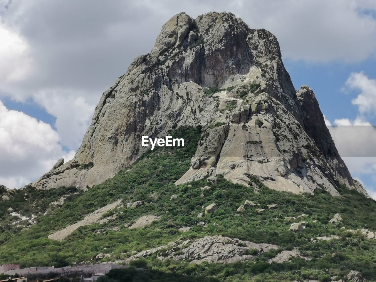 Low angle view of rocks on land against sky