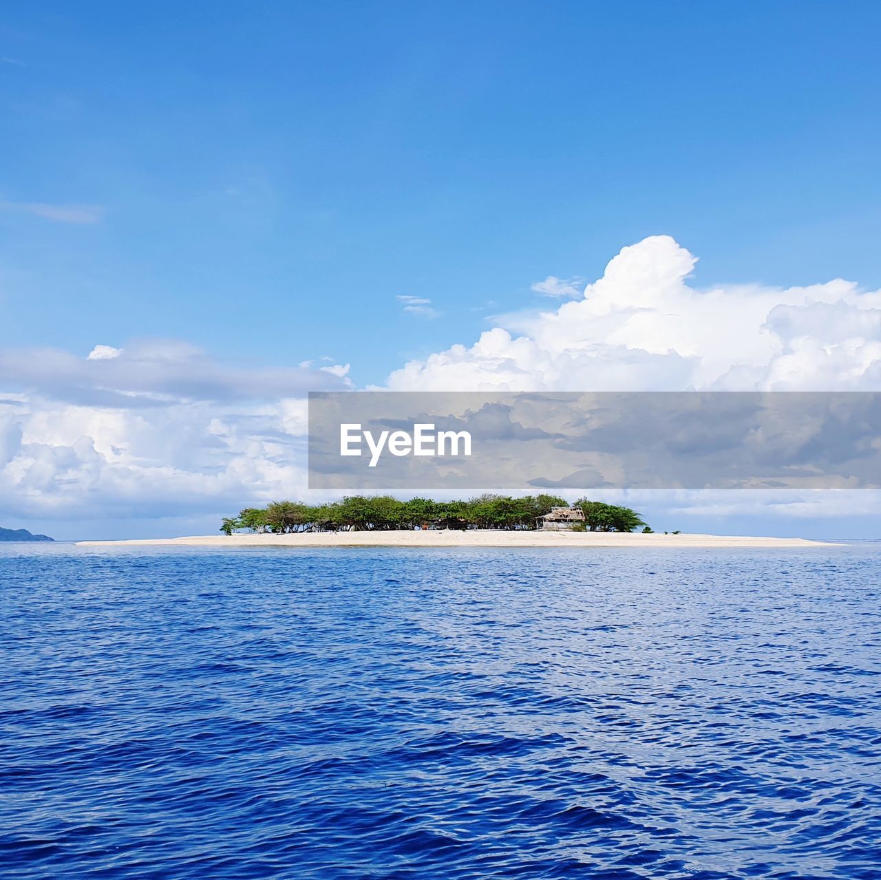 Scenic view of sea against blue sky