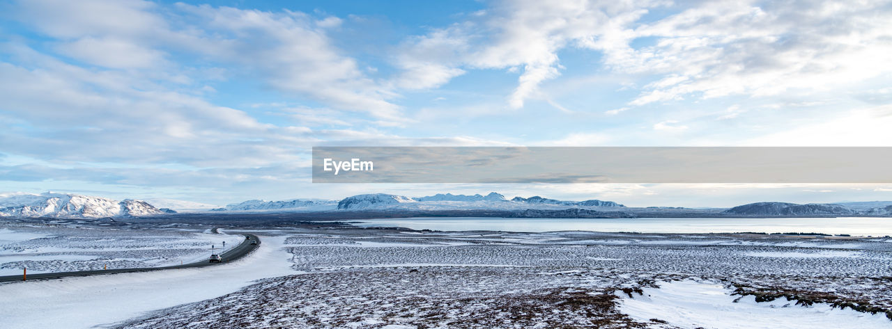 Scenic view of snowcapped mountains against sky