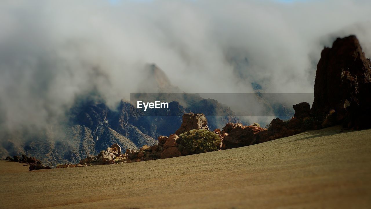 Panoramic view of landscape against cloudy sky