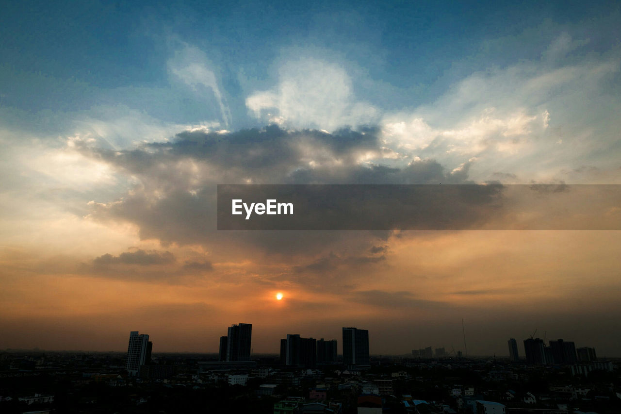 Cityscape against sky during sunset