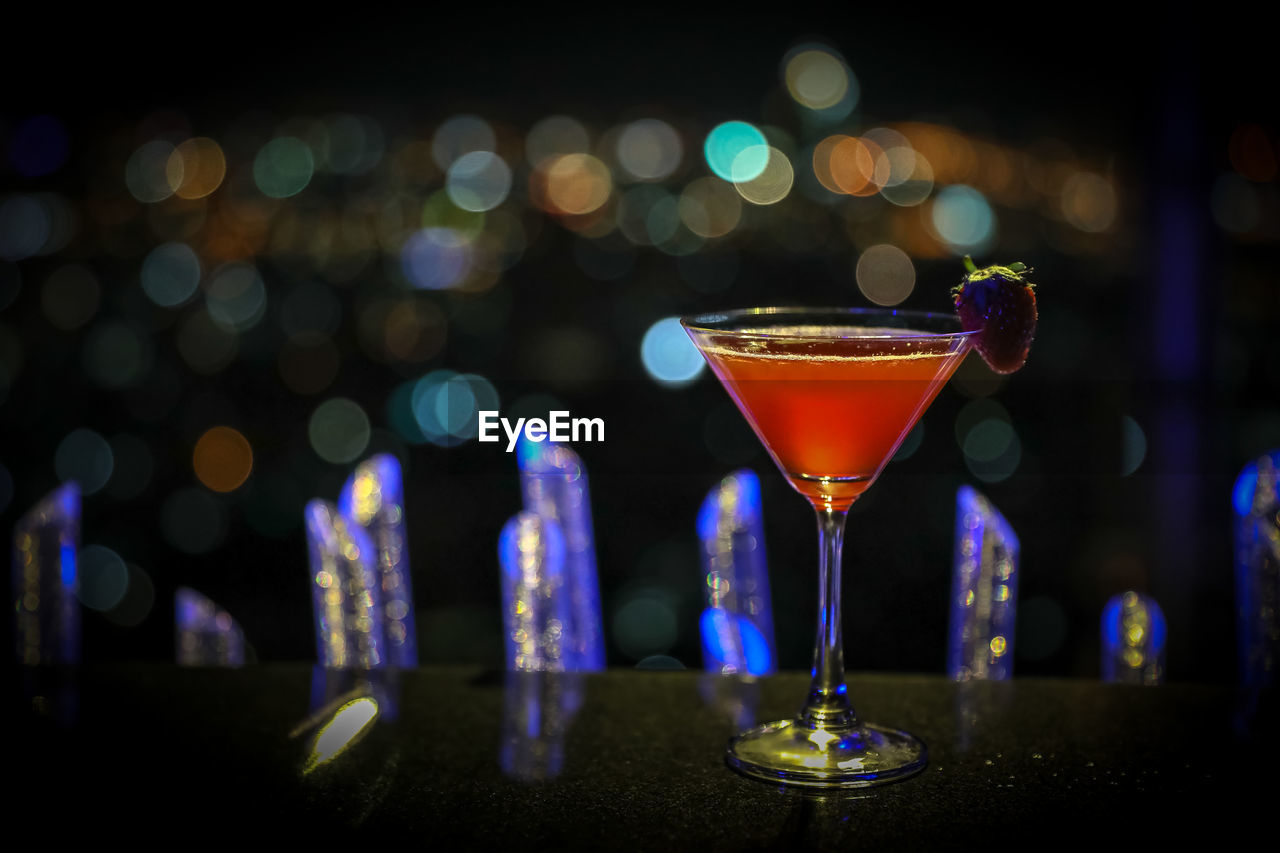 CLOSE-UP OF WINE GLASSES ON BAR