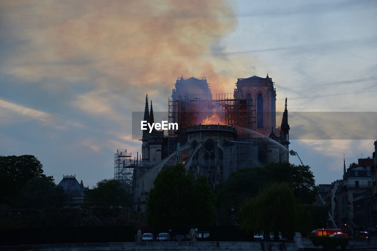 View of burning building in city