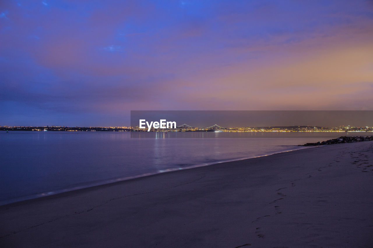 Scenic view of sea against sky at sunset