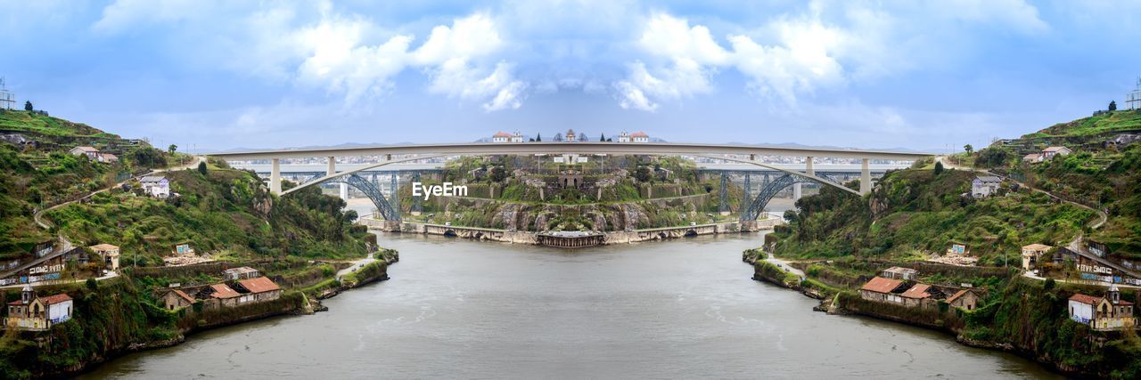 ARCH BRIDGE OVER RIVER AGAINST SKY